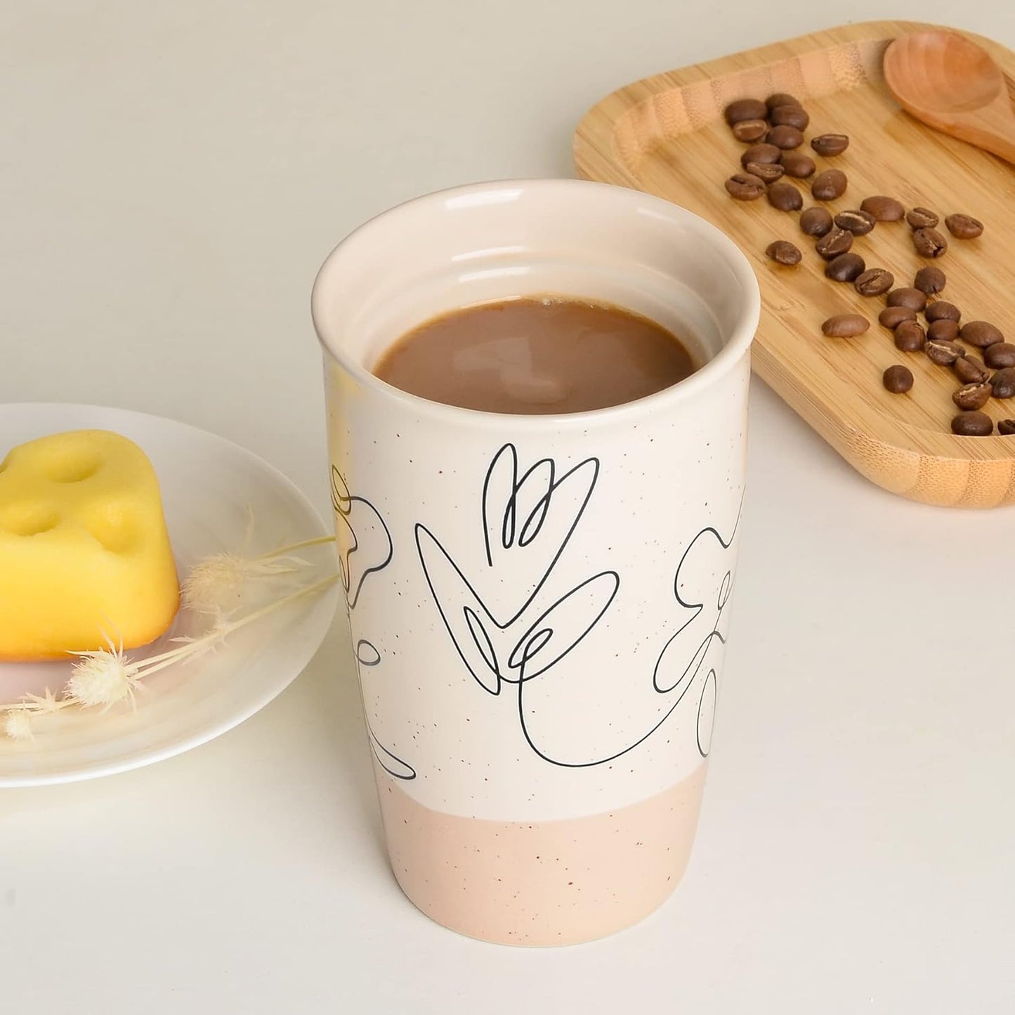 flower pattern ceramic mug, double wall coffee mug, insulated travel mug, 11 oz ceramic tumbler, speckled beige coffee mug, lead-free ceramic mug, BPA-free lid coffee cup, floral design travel mug, dishwasher safe ceramic mug